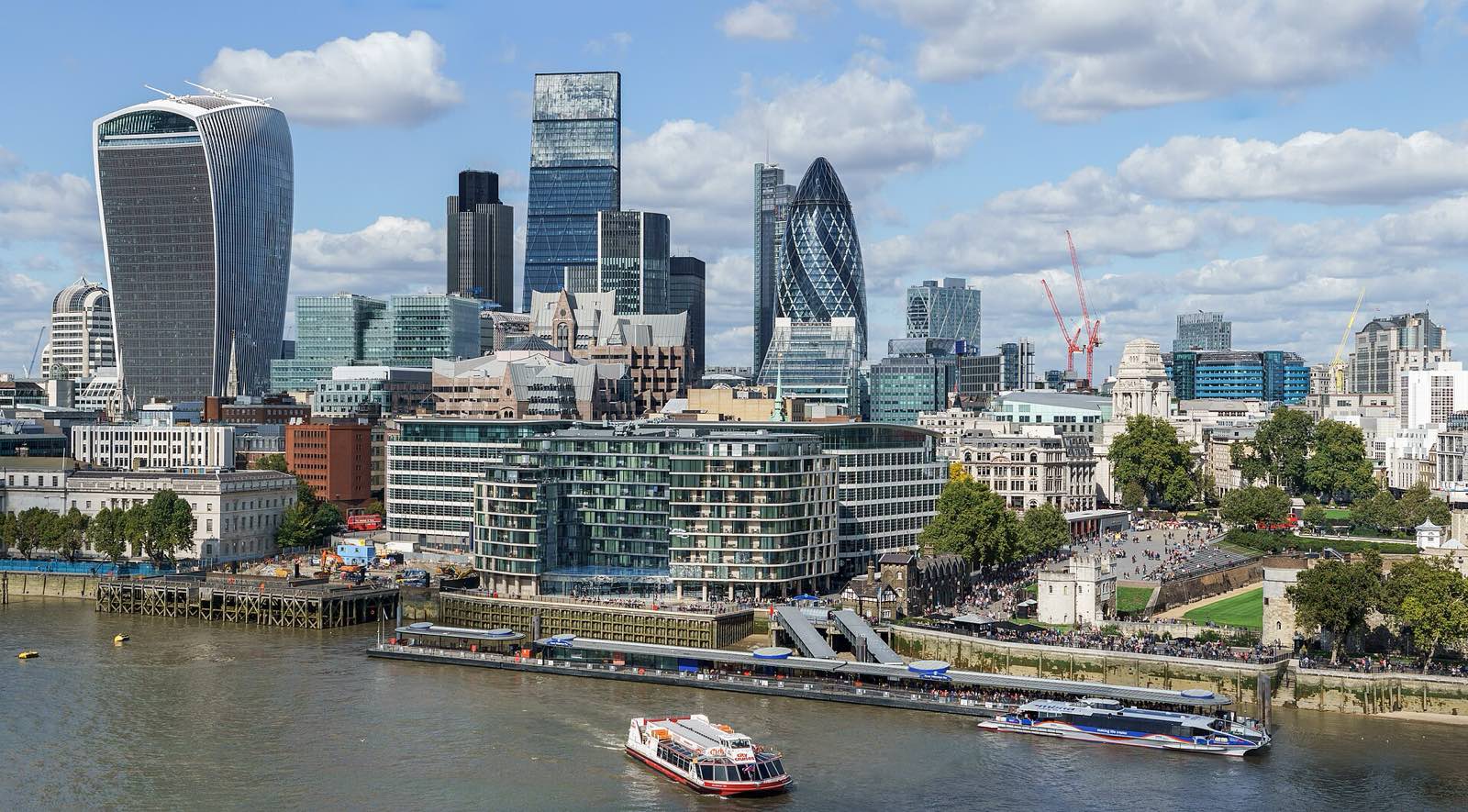 The City of London skyline at dusk, seen across the Thames.